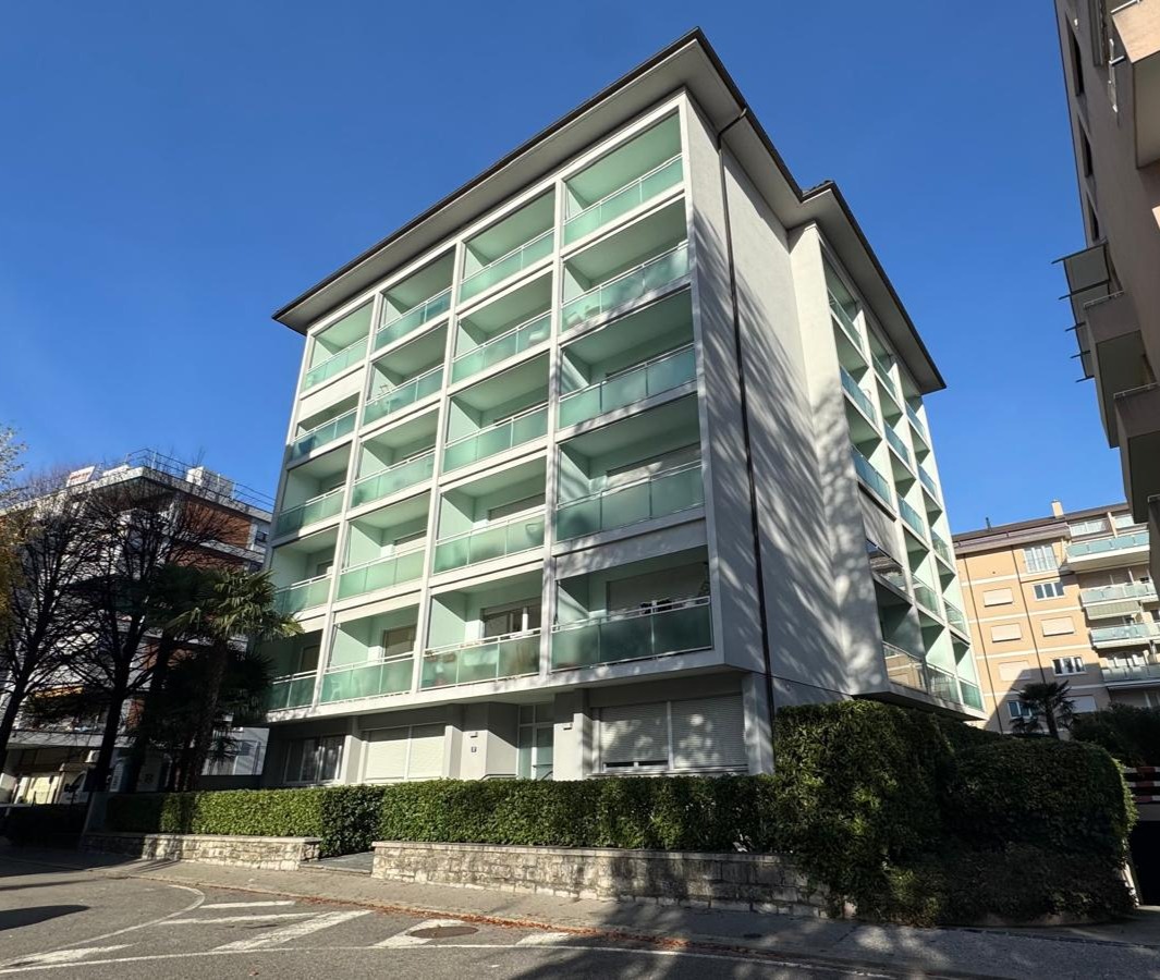 Via Tiglio 17 — front-right view of the residential building in central Lugano under clear sky
