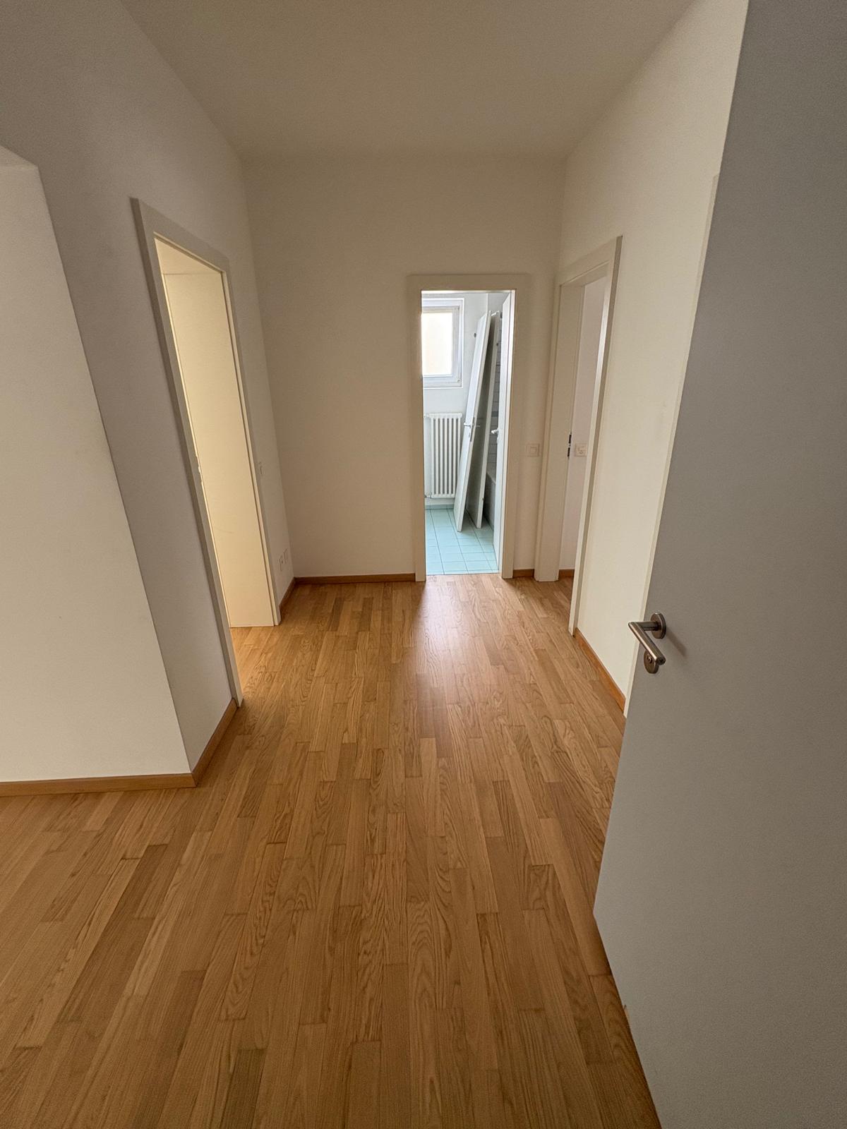 Interior hallway leading to bathroom and bedrooms