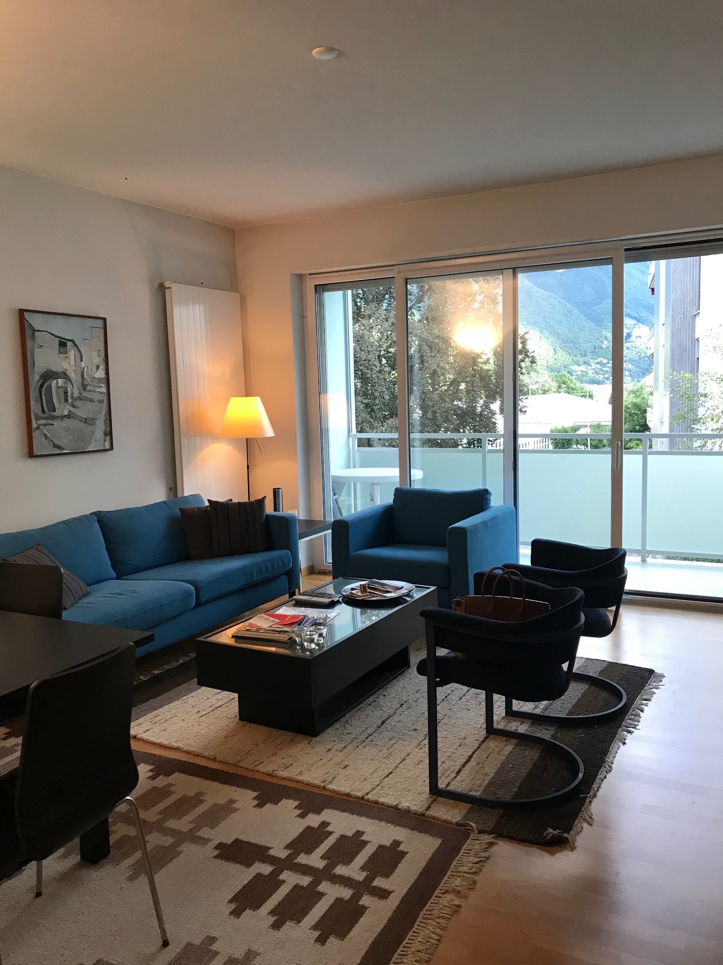 Furnished living room with mountain view and balcony at Via Tiglio 17, Lugano